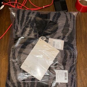 Barefoot Dreams Black and Gray Patterned Throw. 45" x 60" in sealed packaging.